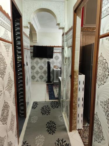 a hallway of a room with a door and a floor at Charming Moroccan apartment in Casablanca