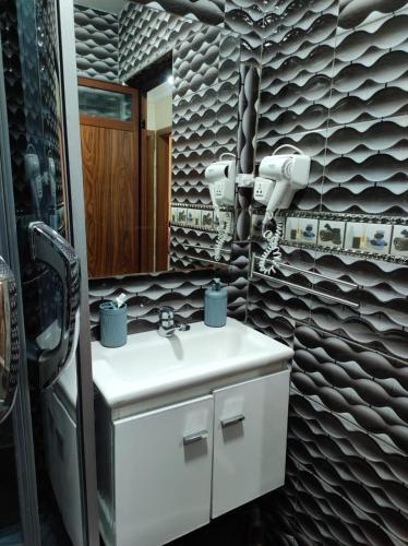 a bathroom with a sink and a mirror at Charming Moroccan apartment in Casablanca