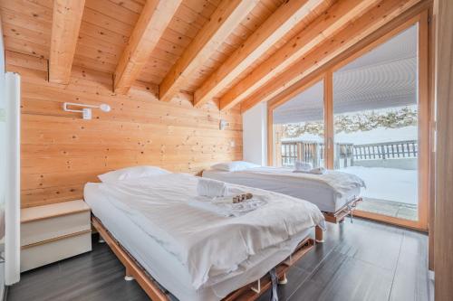 Postel nebo postele na pokoji v ubytování Ski Paradise MOUNTAIN & LUXE apartments
