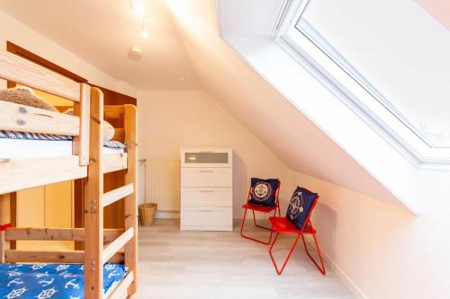 Ένα ή περισσότερα κρεβάτια σε δωμάτιο στο Ferienhaus Lora - Haffkrug