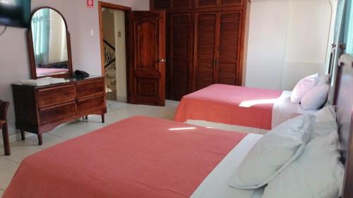 Ένα ή περισσότερα κρεβάτια σε δωμάτιο στο Boutique Hostal Mar de Plata