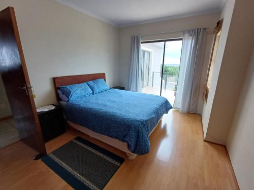 Ένα ή περισσότερα κρεβάτια σε δωμάτιο στο Summer Breeze Views