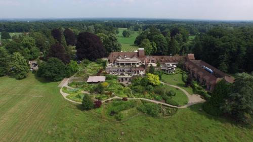 an aerial view of a large house in a field at Landgoed De Wilmersberg in De Lutte