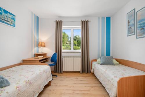 Postel nebo postele na pokoji v ubytování Haus Dodo, Oase Im Grünen