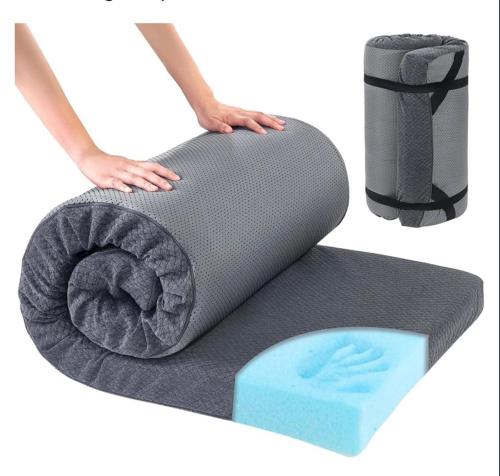 a person holding a grey dog bed and a blue sponge at Cozy Serene Studio Backhouse w parking near it all in South Gate