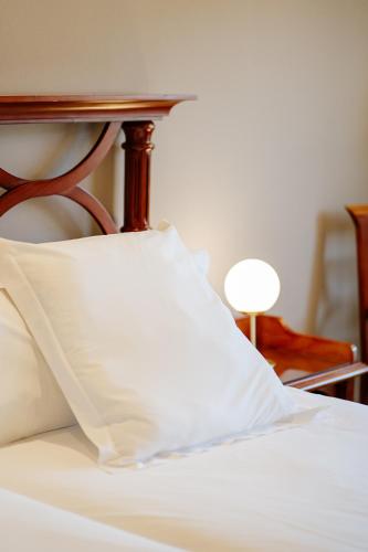 Ένα ή περισσότερα κρεβάτια σε δωμάτιο στο Hotel Reveron Plaza