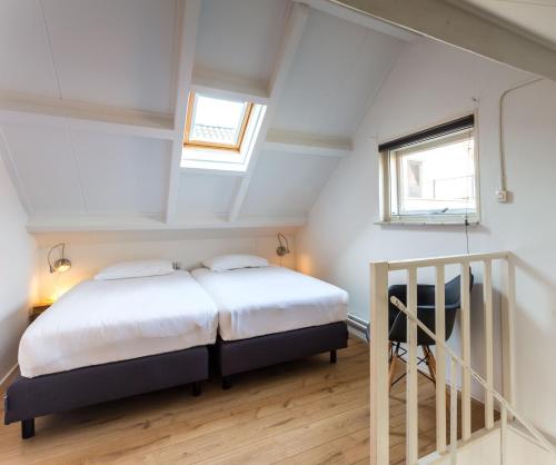 Una cama o camas en una habitación de Appartementen Domburg