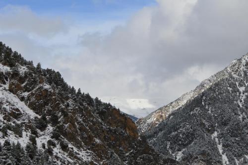 a view of a snowy mountain range with snow at Hotel Parador de Canolich - Only Adults in Bixessarri