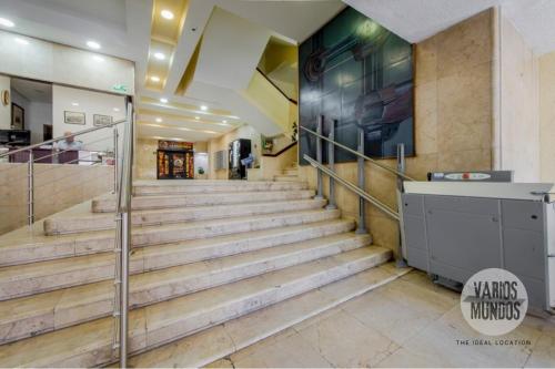 a set of stairs in a building with a lobby at Malasaña a tus pies para 4, descubre San Bernardo 20 E3 in Madrid