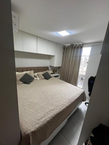 En eller flere senge i et værelse på Apto no Farol Velho - Salinópolis PA