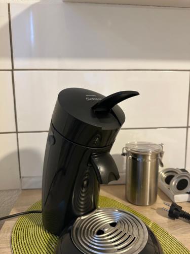 a coffee maker sitting on top of a counter at Ferienwohnung am Berg in Bad Bergzabern