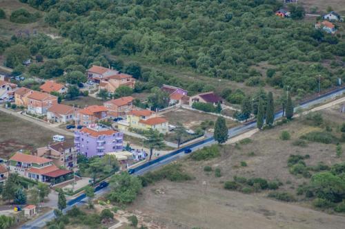 an aerial view of a village with a road and houses at Vila in Lavanda in Fažana