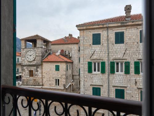a view of a building with a clock tower at Apartment Palata Bizanti in Kotor