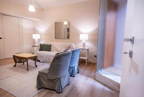 a living room with a couch and a table at Sinatra Suite in Ispica