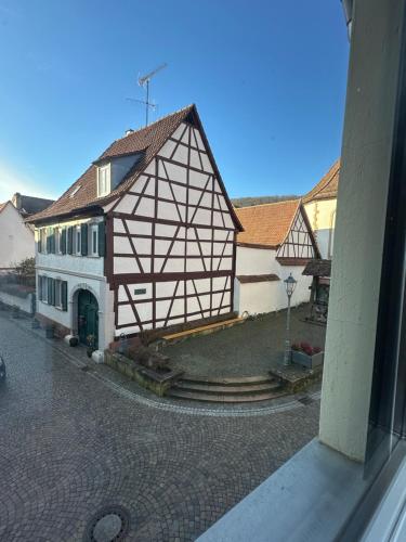 an image of a building on the side of a street at Ferienwohnung am Berg in Bad Bergzabern