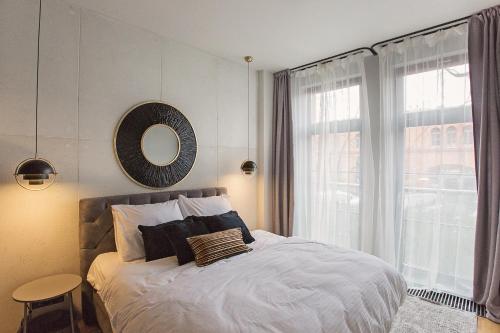 Ένα ή περισσότερα κρεβάτια σε δωμάτιο στο Apartament Husarski - City Park