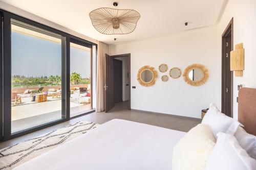 Ένα ή περισσότερα κρεβάτια σε δωμάτιο στο Villa Dar Tillili Marrakech