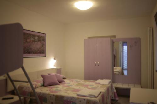Ein Bett oder Betten in einem Zimmer der Unterkunft I Lecci Di Soviore