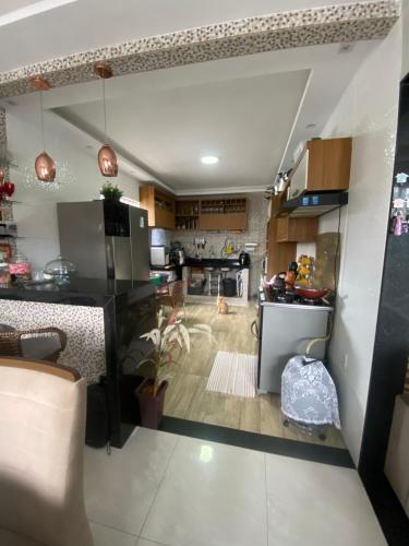 a large kitchen with a dog in the middle at Casa Cop 30 in Belém