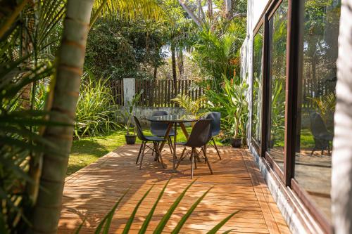 a patio with a table and chairs on it at BarriOceano in El Paredón Buena Vista