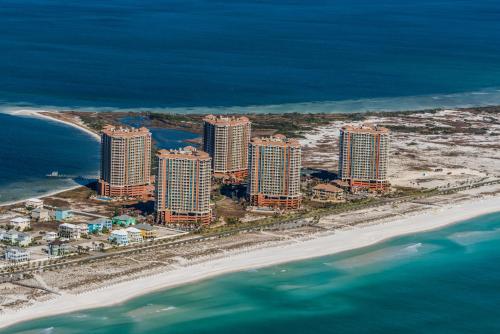 an aerial view of a beach with tall buildings at Oceanfront Tower 3 Gulf & Bay View 3-Bedroom 18th Floor Condo in Pensacola Beach in Pensacola Beach