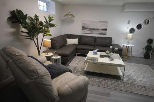 a living room with a couch and a coffee table at Brand New - Tranquil Retreat in Halifax