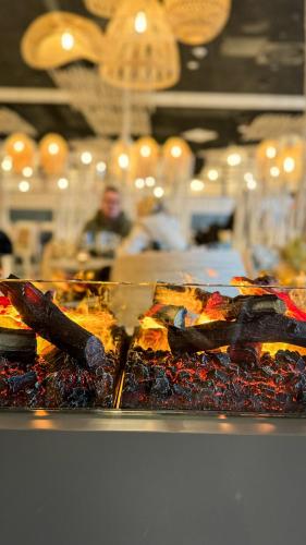 a bunch of food on a counter in a restaurant at SlowDown Bottsand Hotel und Spa in Wendtorf
