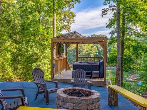 a gazebo with chairs and a table on a patio at Emerald Cove in Dandridge