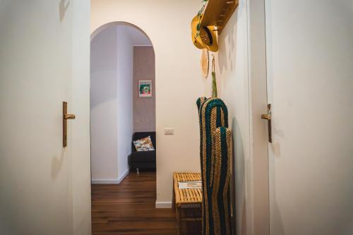 a hallway with an archway and a living room at Old Town Nest in Civitavecchia in Civitavecchia