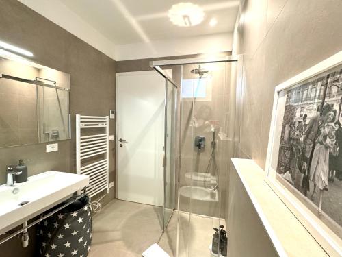 a bathroom with a shower and a sink at Borgo Garda in Peschiera del Garda