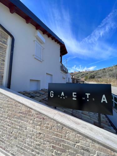 a sign on the side of a building at Gaeta Rooms in Lanciano