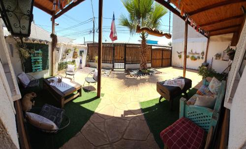 an overhead view of a patio with chairs and a table at Hostal Sol y Luna in Santiago