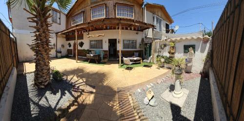 an overhead view of a house with a palm tree at Hostal Sol y Luna in Santiago