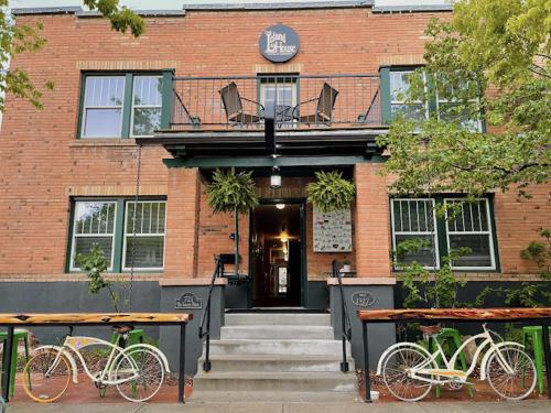 two bikes parked in front of a building at Leland House Suites of Durango in Durango
