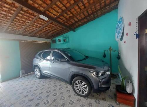 a small car parked in a garage at CASA para COP 30 in Belém