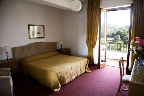เตียงในห้องที่ Hotel Barberino