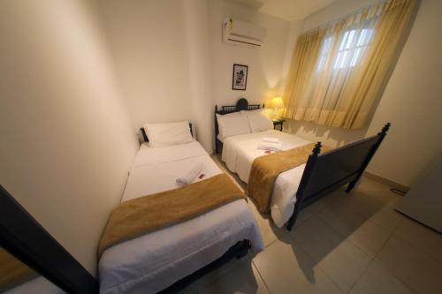 Katil atau katil-katil dalam bilik di Dom Caldeira Hospedaria
