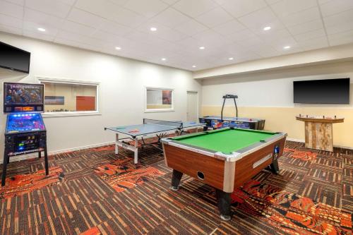 a gaming room with a pool table and a video game at Best Western Red Hills in Kanab