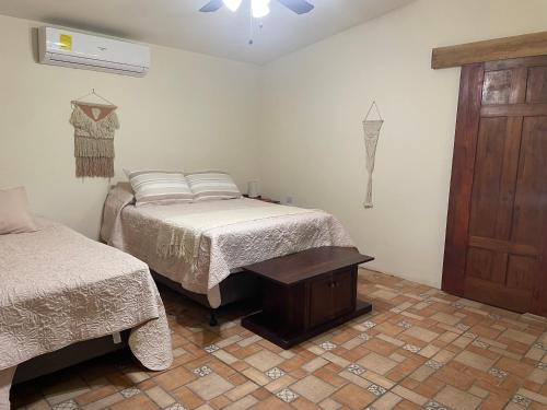 Postel nebo postele na pokoji v ubytování Bella Villa Angeles