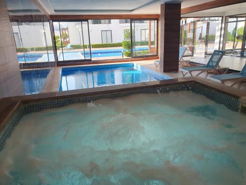 a large swimming pool in a hotel at A dream house with a dream view in ROYAL PARK in Alanya