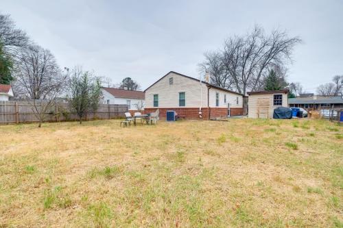 an empty yard with a house and a fence at 1 Mi to Metro DC Area Apt with Fenced Yard! in Silver Spring