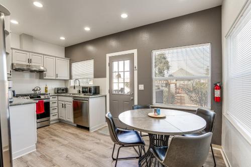 a kitchen with a table and chairs in a room at Walk to Crab Cove Beach Alameda Home with Game Room in Alameda