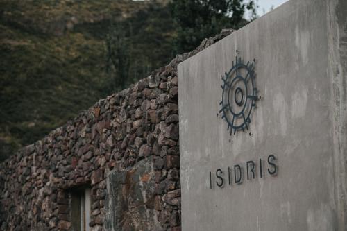 a stone building with a sign that reads isdsabbling at Puesto del Indio in Mendoza