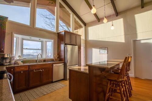 a kitchen with a counter top and a refrigerator at The Tee House in Beech Mountain