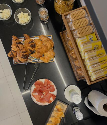 a table with pastries and other food on it at Gaeta Rooms in Lanciano