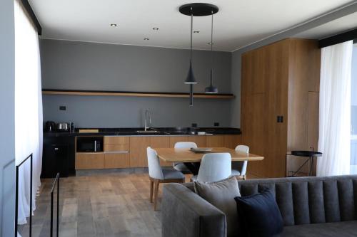 a kitchen and dining room with a table and chairs at Puesto del Indio in Mendoza