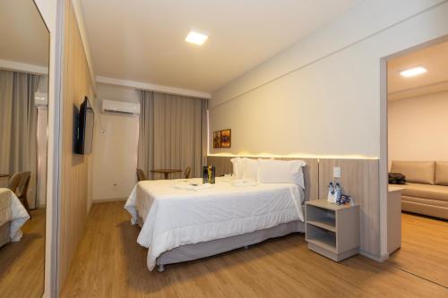 Ένα ή περισσότερα κρεβάτια σε δωμάτιο στο Hotel da Costa By Nobile