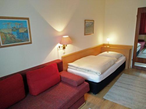 Ένα ή περισσότερα κρεβάτια σε δωμάτιο στο Hotel Alfa