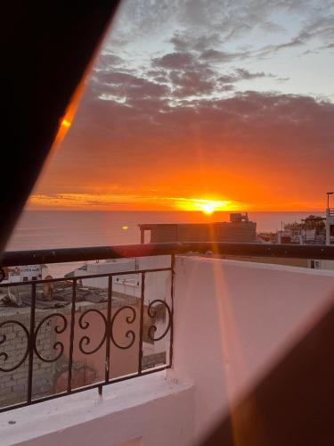 a sunset from the balcony of a cruise ship at Sweet Taghazout Studios in Taghazout