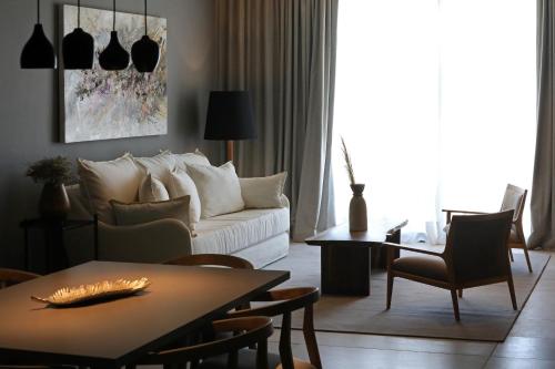 a living room with a white couch and a table at Puesto del Indio in Mendoza